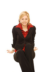 Image showing Smiling sitting blond lady.