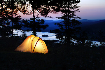 Image showing A tent lit up at dusk 