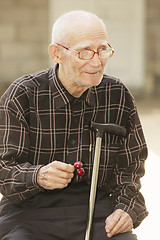 Image showing Senior man with cherry