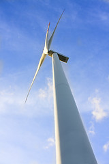 Image showing wind turbine generating electricity on blue sky 