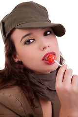 Image showing beautiful young woman with a lollipop 