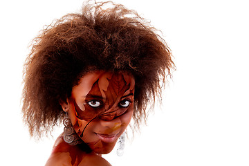 Image showing beautiful black woman, with autumn leaves painted on face