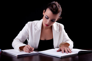 Image showing pretty woman in desk with papers