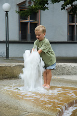 Image showing Boy Playing With Fountain