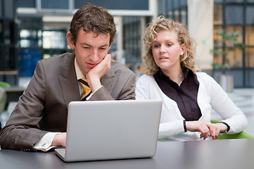 Image showing Curious Businesswoman Looking At Her Colleague