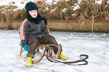 Image showing Boy On A Sleigh