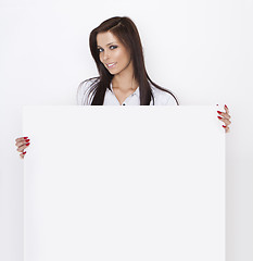 Image showing Woman holding blank billboard
