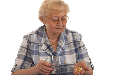 Image showing Taking pills