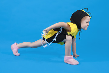 Image showing Small girl is dressed at bee costume