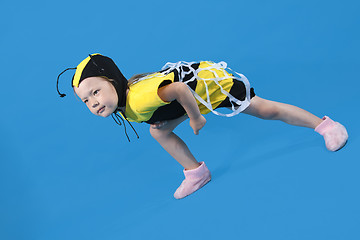 Image showing Small girl is dressed at bee costume