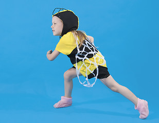 Image showing Small girl is dressed at bee costume