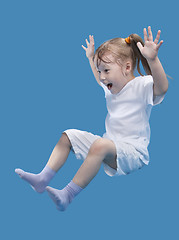 Image showing Small happiness girl is jumping