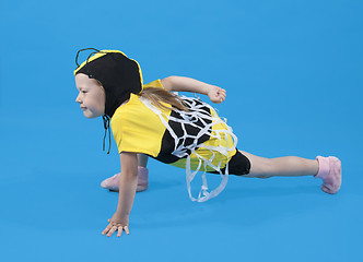 Image showing Small girl is dressed at bee costume