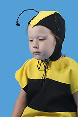 Image showing Small girl is dressed at bee costume