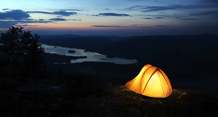 Image showing A tent lit up at dusk 