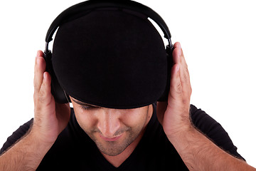 Image showing man with hat listening music in headphones