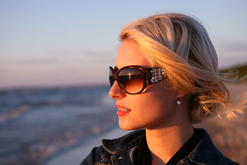 Image showing Young woman  look on sunset