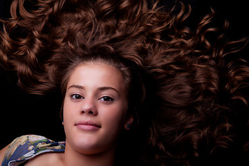 Image showing beautiful girl lying looking up