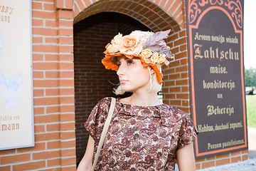 Image showing Beautiful young model in hat on old city