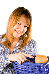 Image showing woman with a basket full of apples