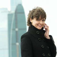 Image showing Smiling woman with phone