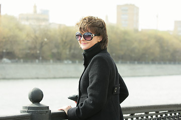 Image showing Young smiling woman in sunglasses