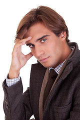 Image showing Portrait of a young businessman thinking, in autumn/winter clothes,