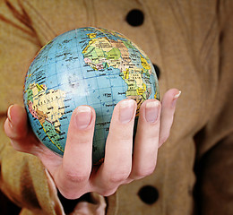 Image showing Globe in a girl's hands