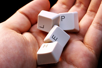 Image showing HELP - keyboard in a hand ! Close-up with great details !