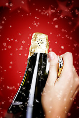 Image showing Opening champagne bottle