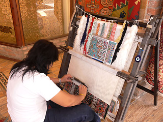 Image showing Weaving an carpet. 