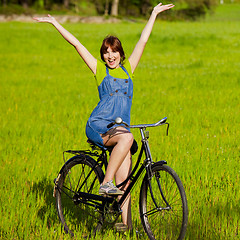 Image showing Girl with a bicycle