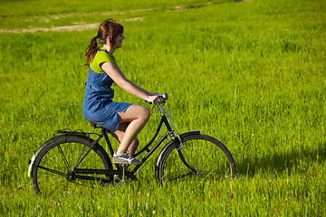 Image showing Riding a bicycle