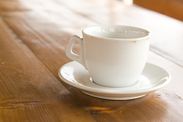 Image showing coffee cup on wooden table