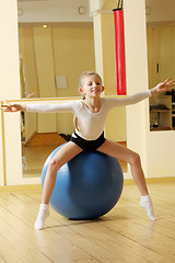 Image showing Little gymnast girl on ball