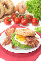 Image showing Bagel with fried egg and bacon