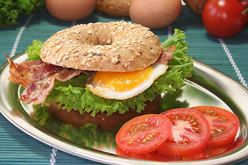 Image showing Bagel with fried egg and bacon