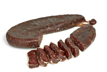 Image showing Piece of turkic summer sausage (Sucuk)  and few slices