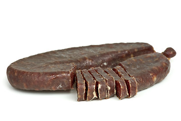 Image showing Piece of turkic summer sausage (Sucuk)  and few slices