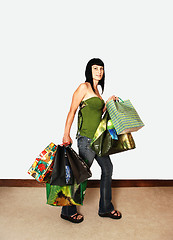 Image showing Girl back from shopping.