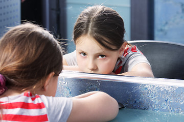 Image showing Boring girl at mirror