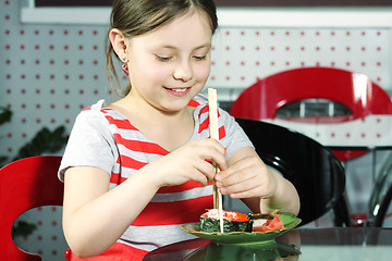 Image showing Girl with sticks