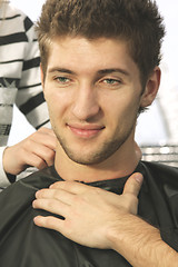 Image showing Contented guy at barbers shop