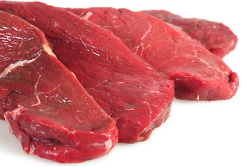 Image showing Four rump steaks, close-up