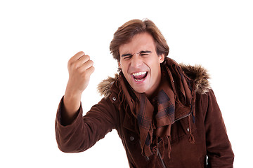 Image showing Portrait of a very happy  man with his arm raised