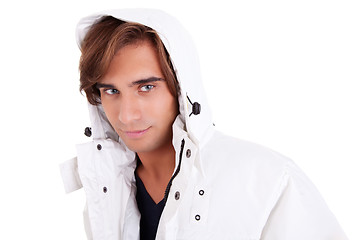 Image showing Portrait of a young man with a hood , in autumn/winter clothes