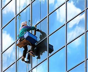 Image showing window cleaner at work