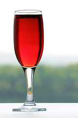 Image showing glass with wine on nature background