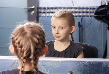 Image showing Girl looking at her reflection