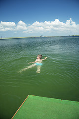 Image showing Kid swimming in sea